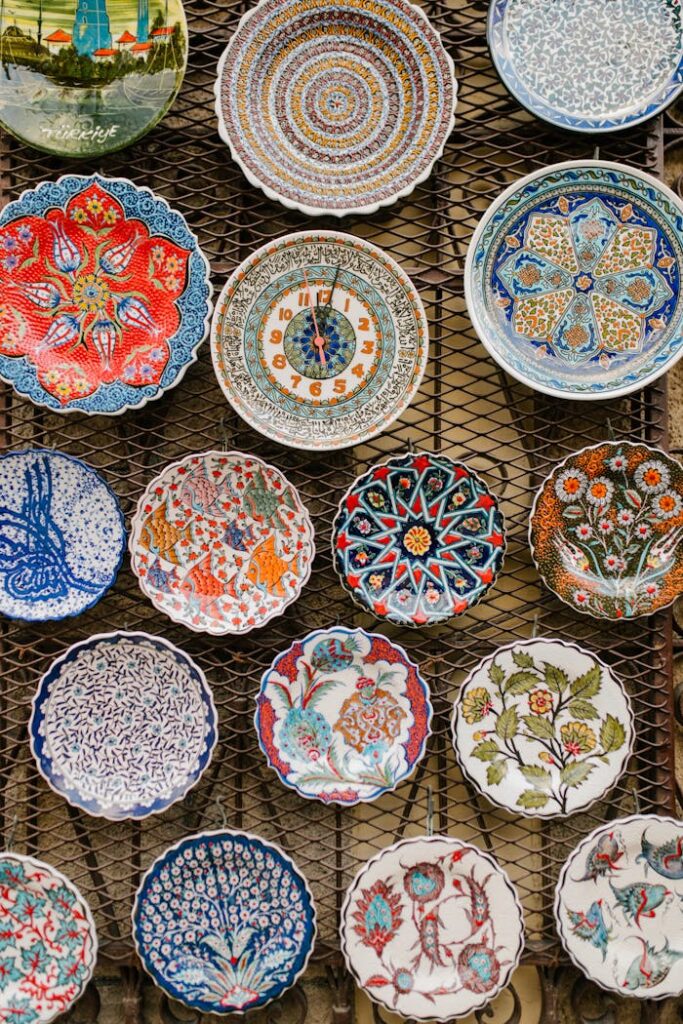 A diverse assortment of intricately decorated ceramic plates with oriental designs on display.